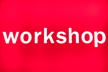 Workshop word on red background