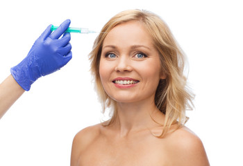happy woman face and beautician hand with syringe