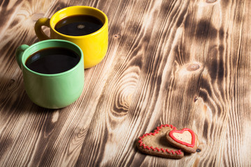 Coffee in cup on wooden table for background