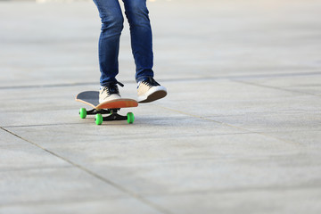 skateboarding legs at skatepark