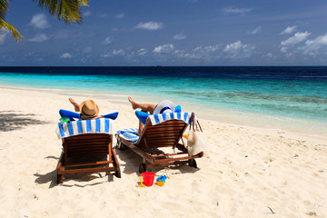 happy couple relax on a tropical beach