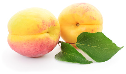 Apricots with leaves.