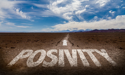 Positivity written on desert road
