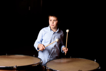 Little drummer with drumsticks