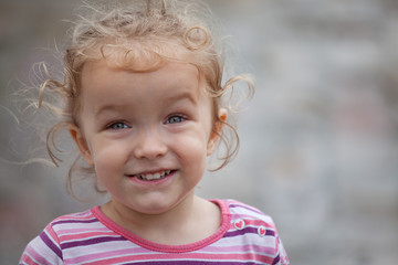 Beautiful little girl making funny faces