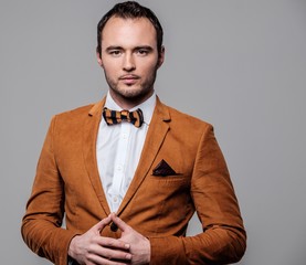 Sharp dressed fashionist wearing jacket and bow tie