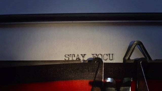 Old typewriter types message. Close up on words.
Message is "Stay Focused"