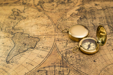 old compass on vintage map