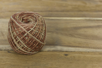 roll of colorful jute, string, hemp rope on wooden backgroun