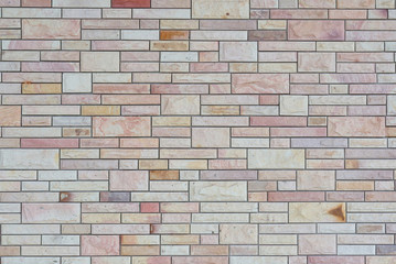 Exterior white and brown brick wall, textured wall background.