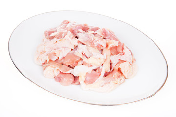 Chicken, cut into pieces on a white background.