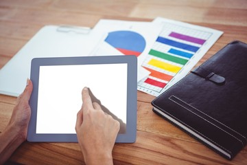 Over shoulder view of hipster woman using tablet