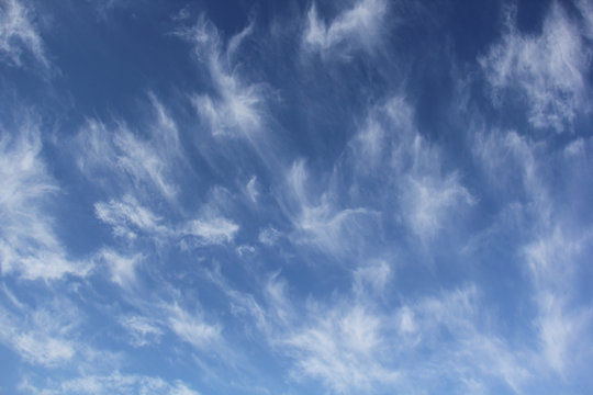 Cloudscape of cirrus uncinus clouds in blue sky