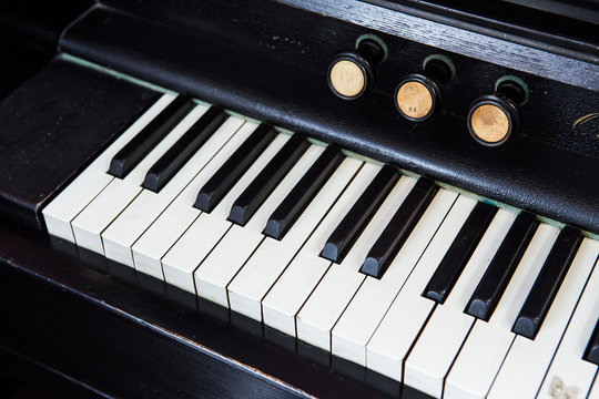 Closeup of antique piano keys