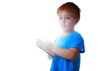 Adorable little boy reading book. isolated on white background