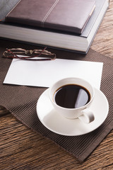 Cup of coffee with books