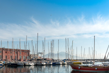 Fototapeta na wymiar Street view of Naples harbor with boats, italy Europe