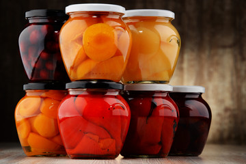 Jars with fruity compotes and jams. Preserved fruits