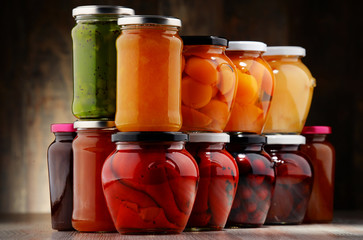 Jars with fruity compotes and jams. Preserved fruits