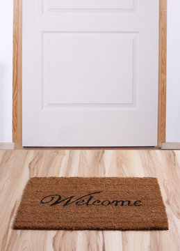 Door with welcome mat