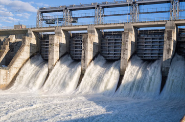 Water rushing out of opened gates of a hydro electric power dam 