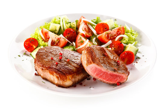 Grilled steaks and vegetable salad 