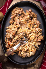 Traditional polish sauerkraut (bigos) with mushrooms and meat.