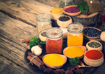 Spices and herbs on the wooden table