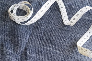 Background of denim with the measuring tape
