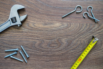 Different tools on a wooden background. Fathers day card.