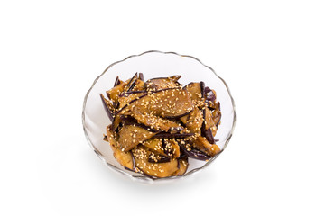 Eggplant sauteed in butter, sprinkled with sesame seeds. Isolated on white.