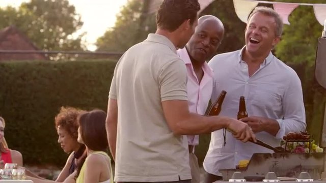 Mature Friends Enjoying Outdoor Barbeque Shot On R3D
