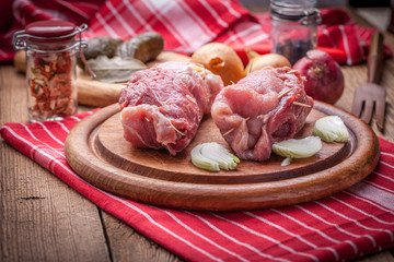Raw beef roulades prepared for frying.