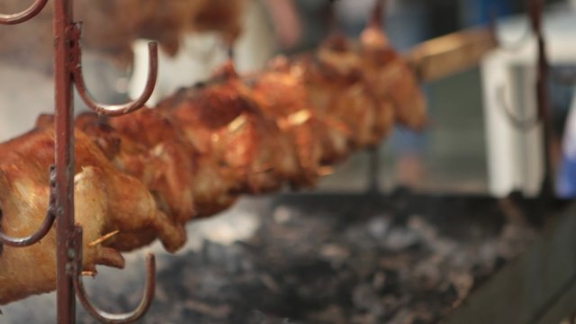 Grilled roasted chickens on a spit at Kardzhali Turkish festial - Bulgaria