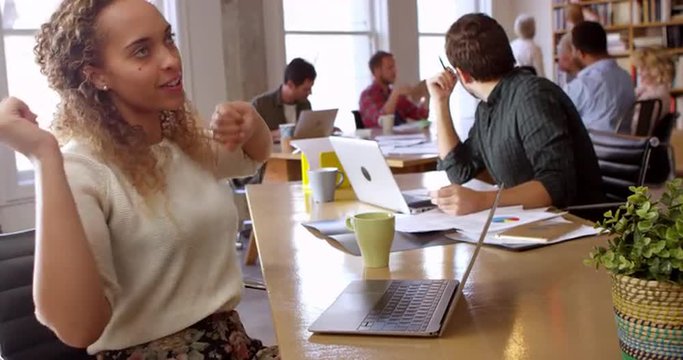 Businesswoman Dancing At Desk In Office Shot On R3D
