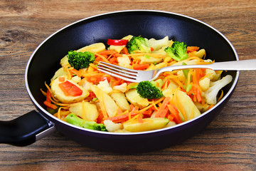 Steamed vegetables potatoes, carrots, corn, green beans, onion