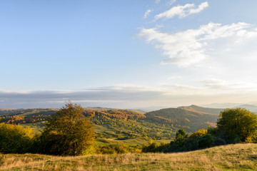 Fototapeta na wymiar Mountain autumn landscape with colorful forest. Horizontal panor