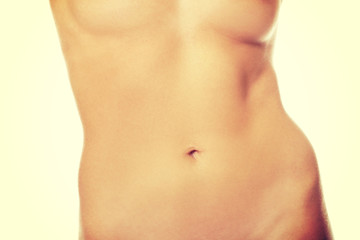 Fototapeta na wymiar Slim naked woman's belly