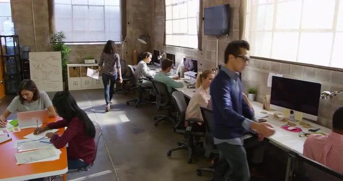 Elevated View Of People Working In Modern Design Office Shot On R3D
