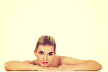 Fototapeta premium Young beautiful woman based on table