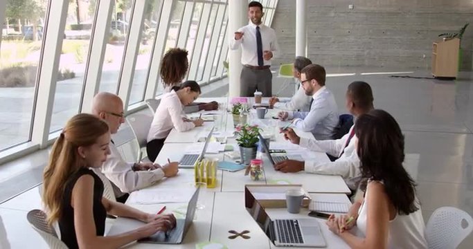 Businessman Leading Meeting At Boardroom Table Shot On R3D