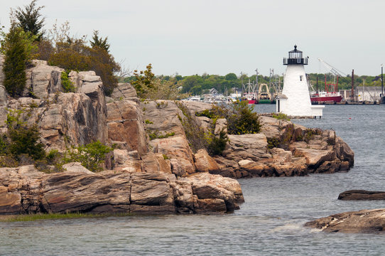 Palmer Island lighthouse protects mariners from rocky islands in New Bedford Harbor, in Massachusetts.