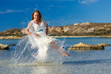 Girl in the sea splashing water