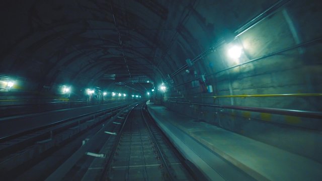 Fast ride in a dark underground tunnel