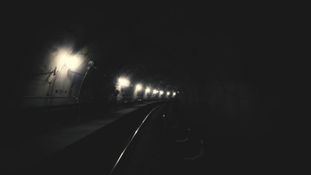 Ride of a train in a very dark underground tunnel