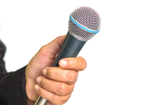 microphone, which woman reporter is holding and waiting for the