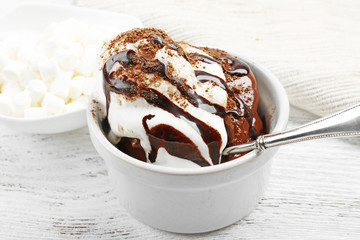 Chocolate lava cake with ice-cream on the table, close-up