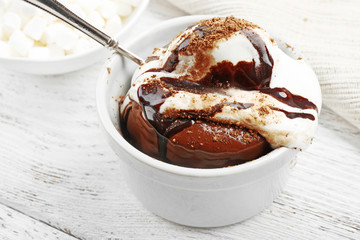 Chocolate lava cake with ice-cream on the table