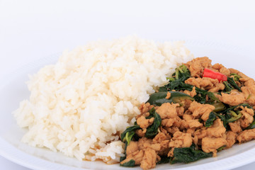 Rice topped with stir-fried chicken and  basil, fried stir basil with minced chicken on white background (Isolated Background)