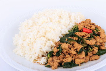 Rice topped with stir-fried chicken and  basil, fried stir basil with minced chicken on white background (Isolated Background)